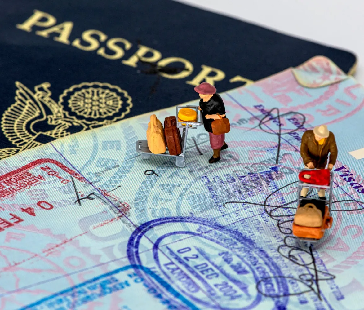 Passport open on visa stamps